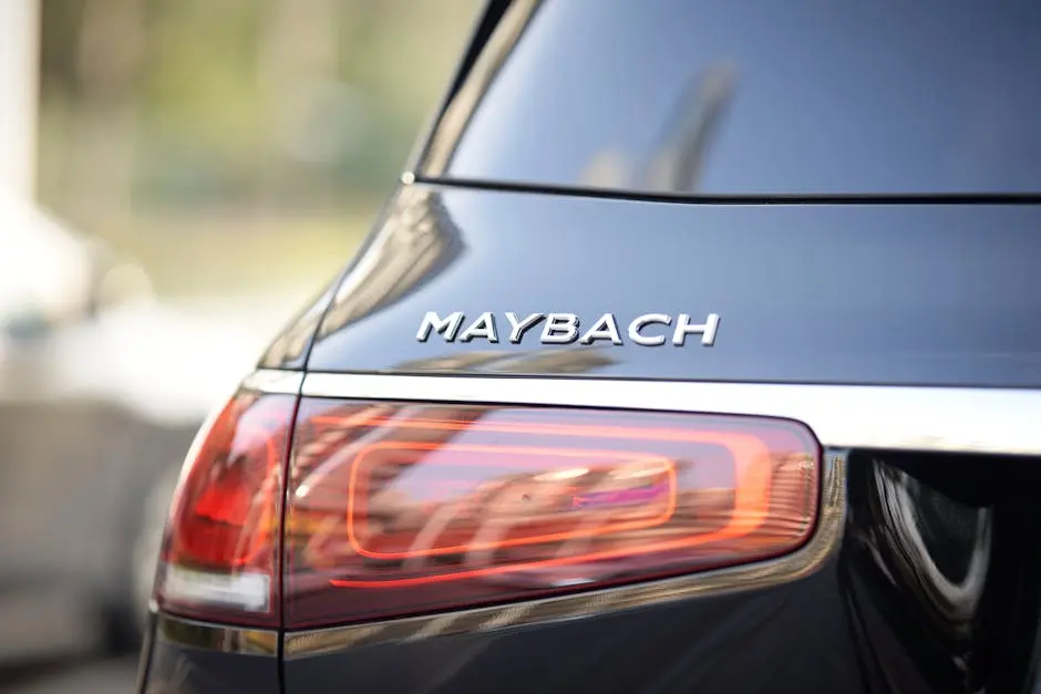 Close-up of Maybach car taillight showcasing luxury design and branding.