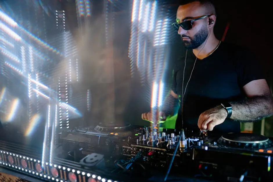 A Disc Jockey Wearing Black Shirt while Performing on a Nightclub