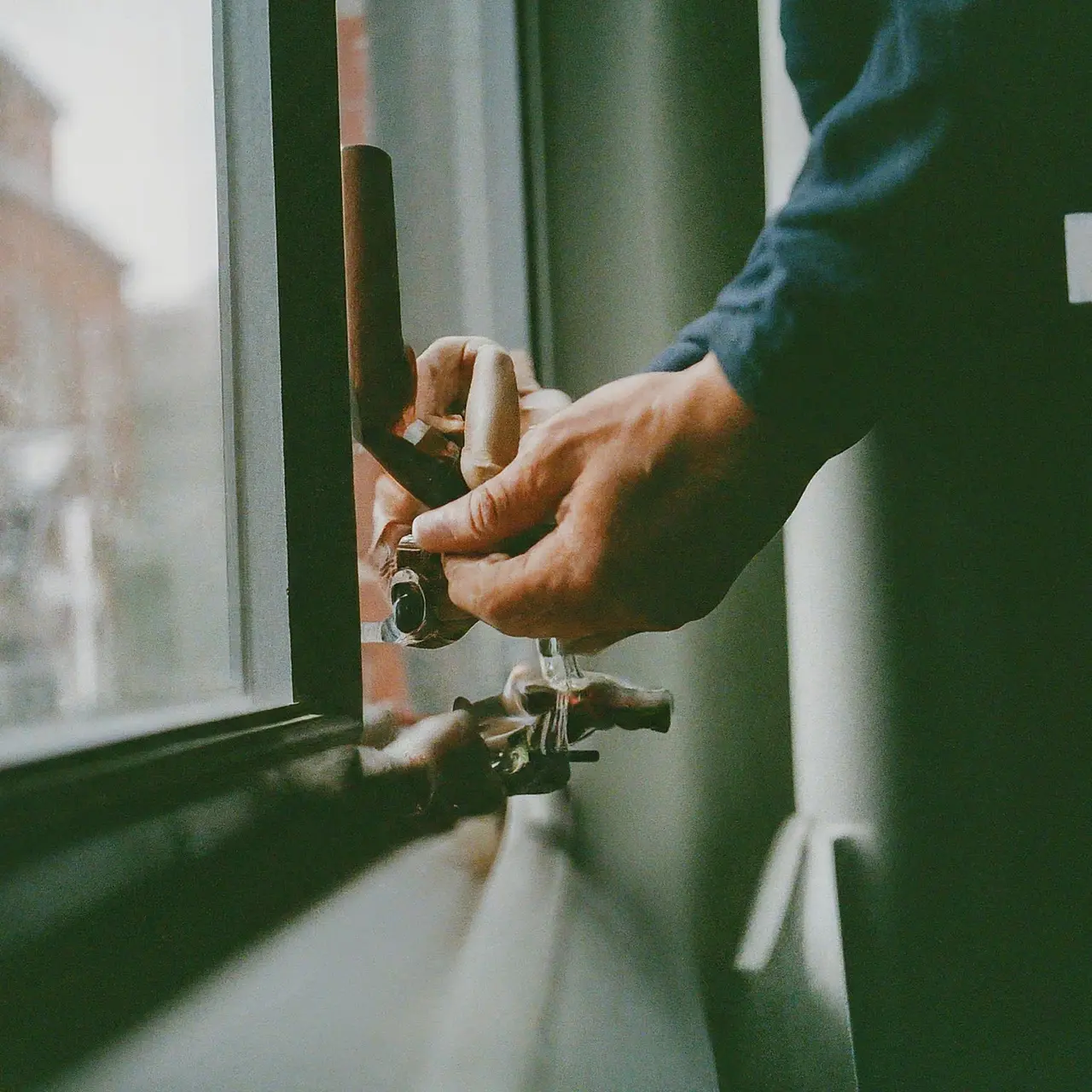 A technician repairing a residential heating system. 35mm stock photo