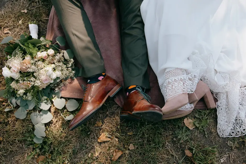 Overhead Shot of a Newlywed Couple Lying Down on the Ground