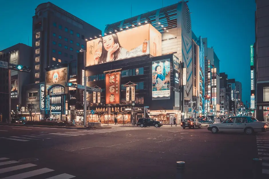 Illuminated Advertisements on Buildings in City in Evening