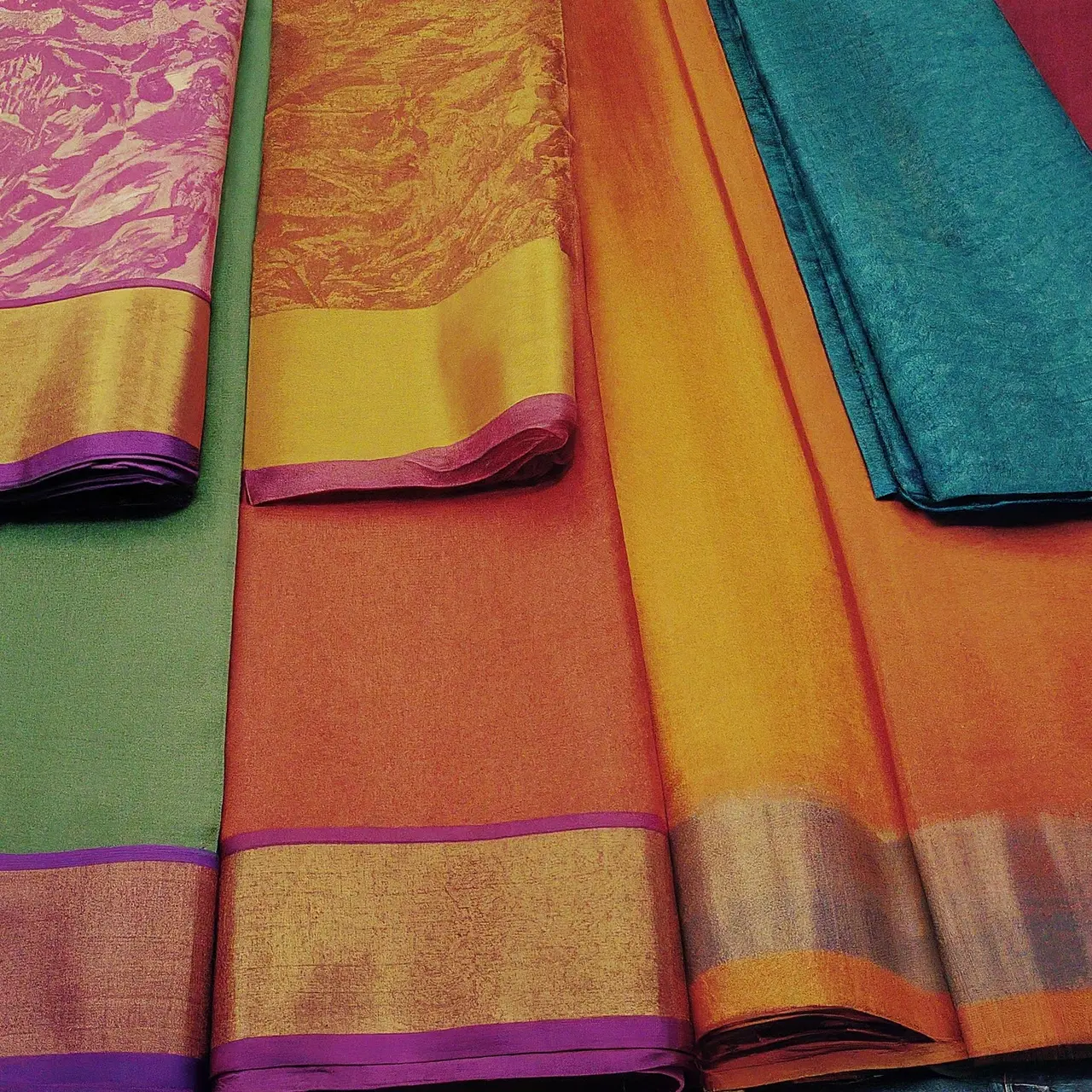 A colorful display of traditional and modern Tant sarees. 35mm stock photo