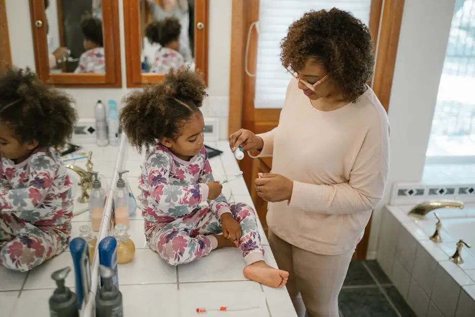 Child Cleaning Teeth with Mother Supervision