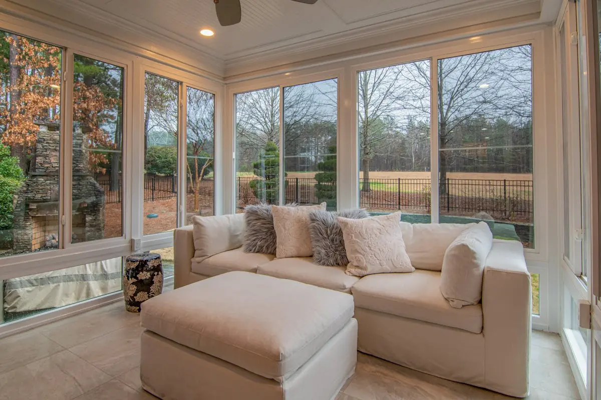 White Couch Near Glass Windows