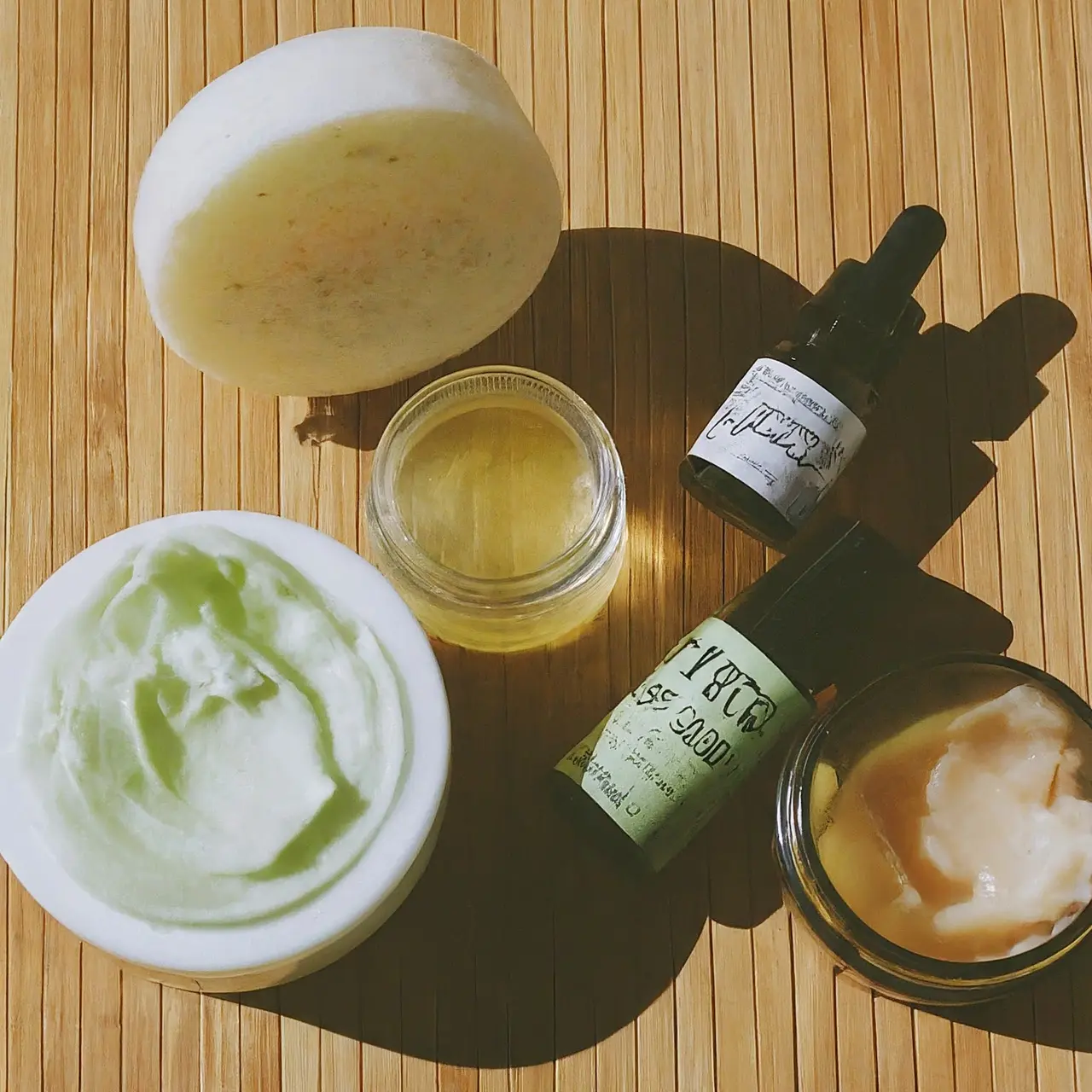 Assorted vegan skincare products on a bamboo surface. 35mm stock photo