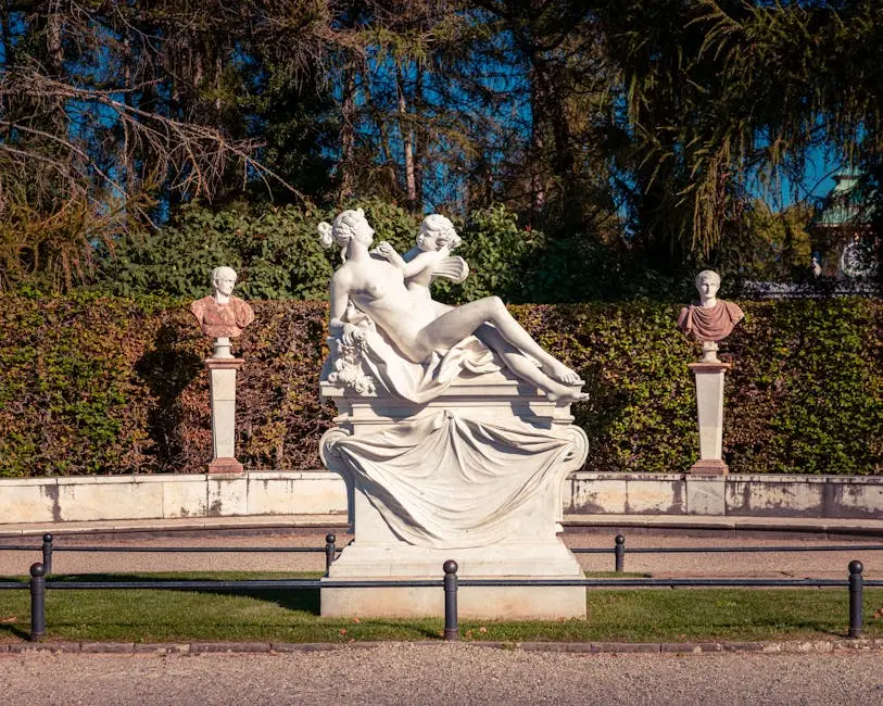 Classical Marble Sculpture in Lush Garden Setting