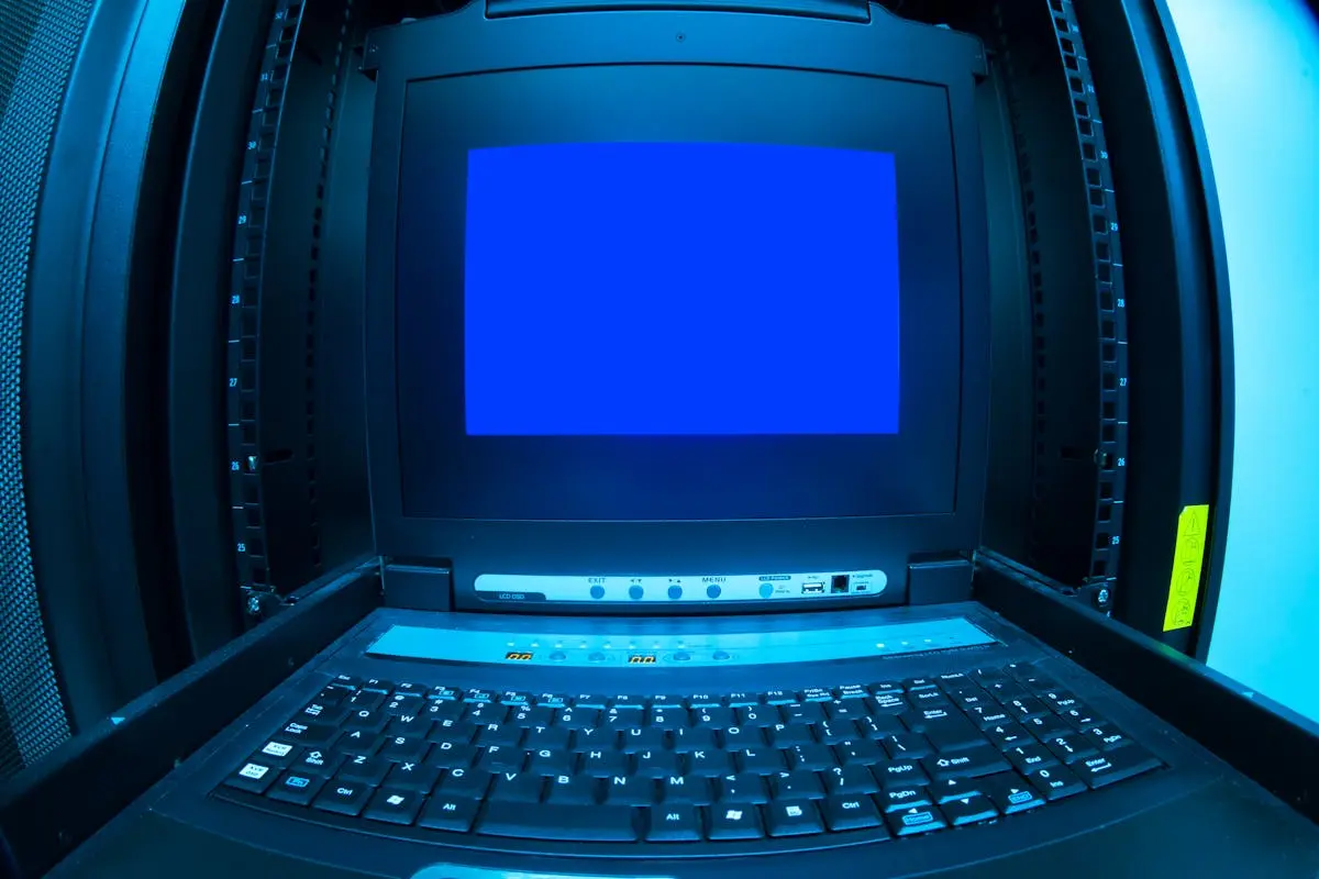 Close-up of a blue screen error shown on a data center control terminal.