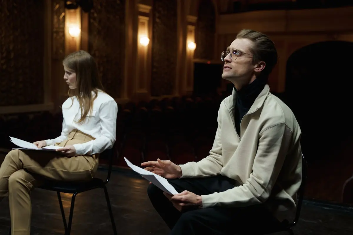 Man And Woman Sitting With Their Scripts