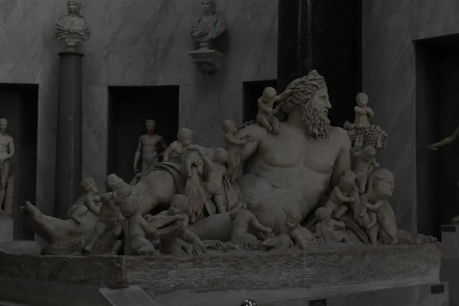 Detailed marble sculpture depicting historical figures in a classical museum setting.