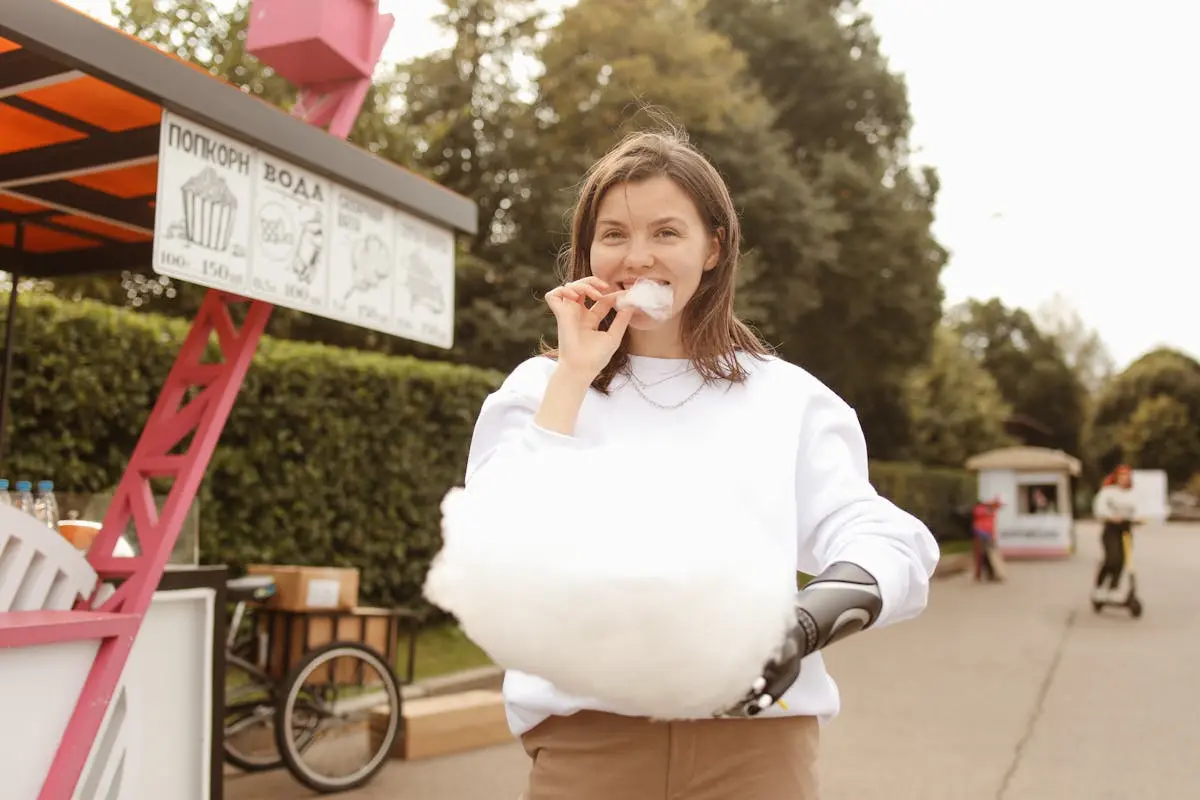 A Woman Eating Cotton Candy