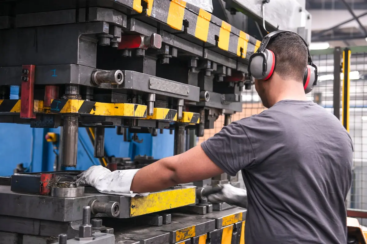 Worker with Hearing Protection in Factory