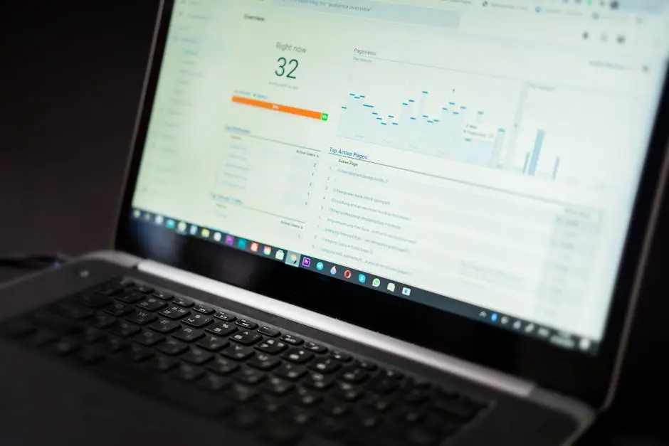 A laptop displaying an analytics dashboard with real-time data tracking and analysis tools.