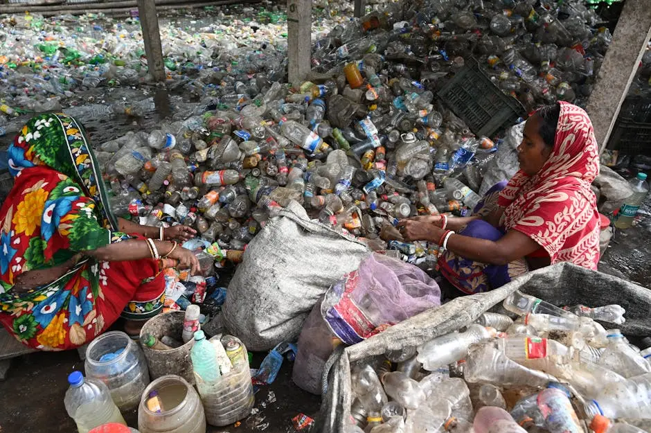 Woman Sitting on Recycled Trash of Plastic Bottles