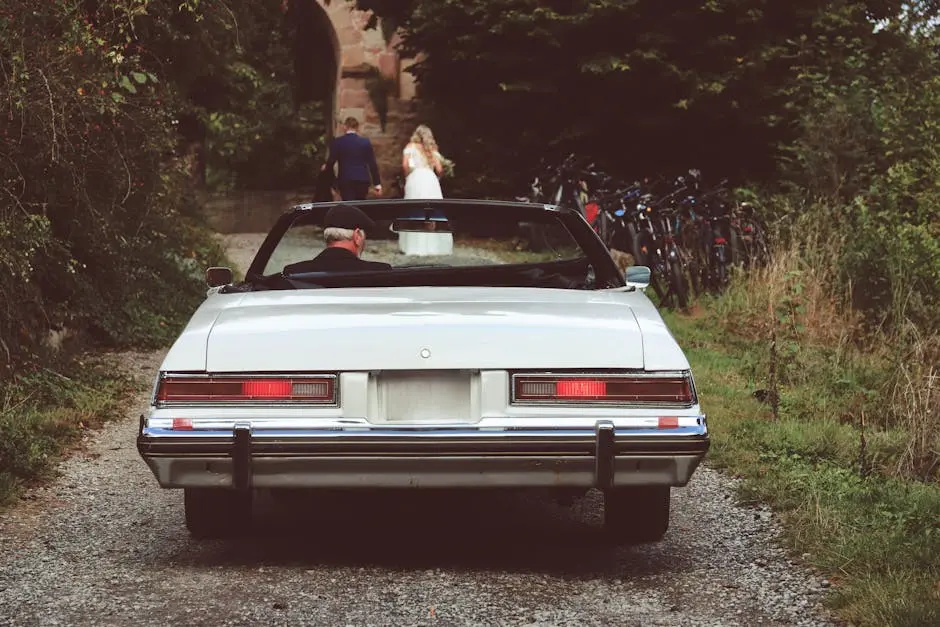 Classic Car with Bride and Groom in Background