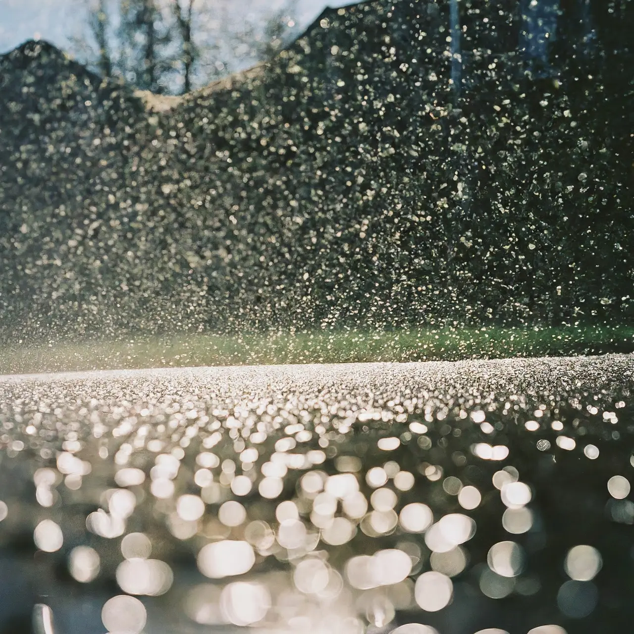 A clean, pressure-washed driveway with sparkling water droplets. 35mm stock photo