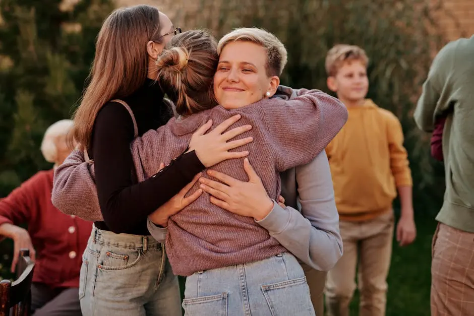 A touching moment of a family reunion with members happily embracing outdoors.