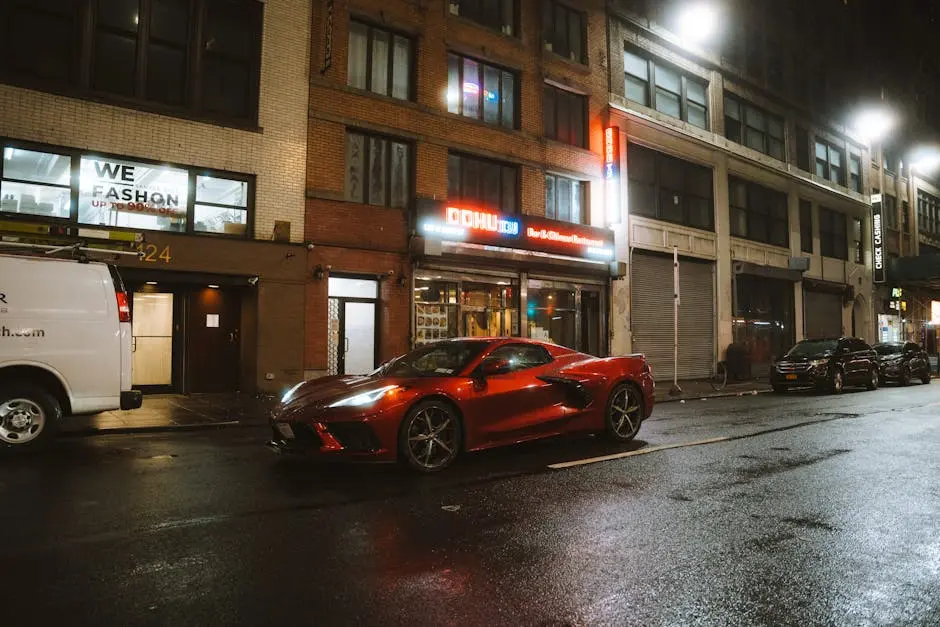 Red Chevrolet Corvette on Street in City at Night