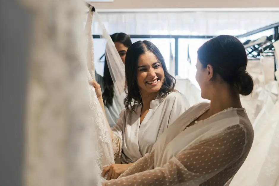 Bride and bridesmaid share a joyful moment while preparing for a wedding, showcasing friendship and excitement.