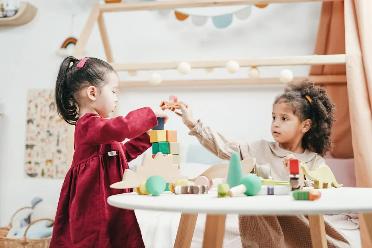 Girl In Red Dress Playing A wooden Blocks and creating marine characters