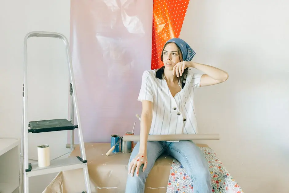 Woman in White Button Up Shirt Sitting on White Chair