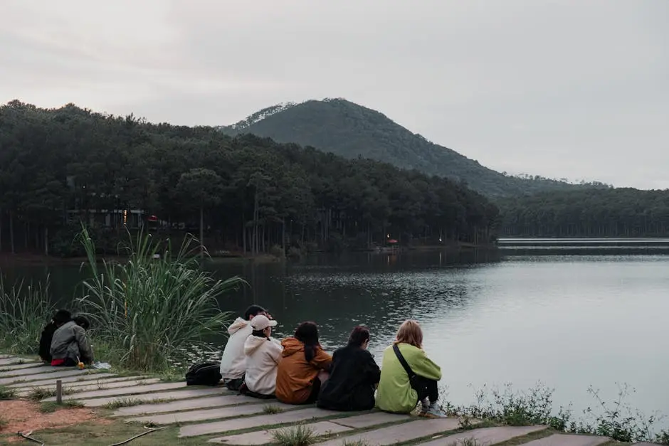 Group Enjoying Lake View in Serene Forest Setting