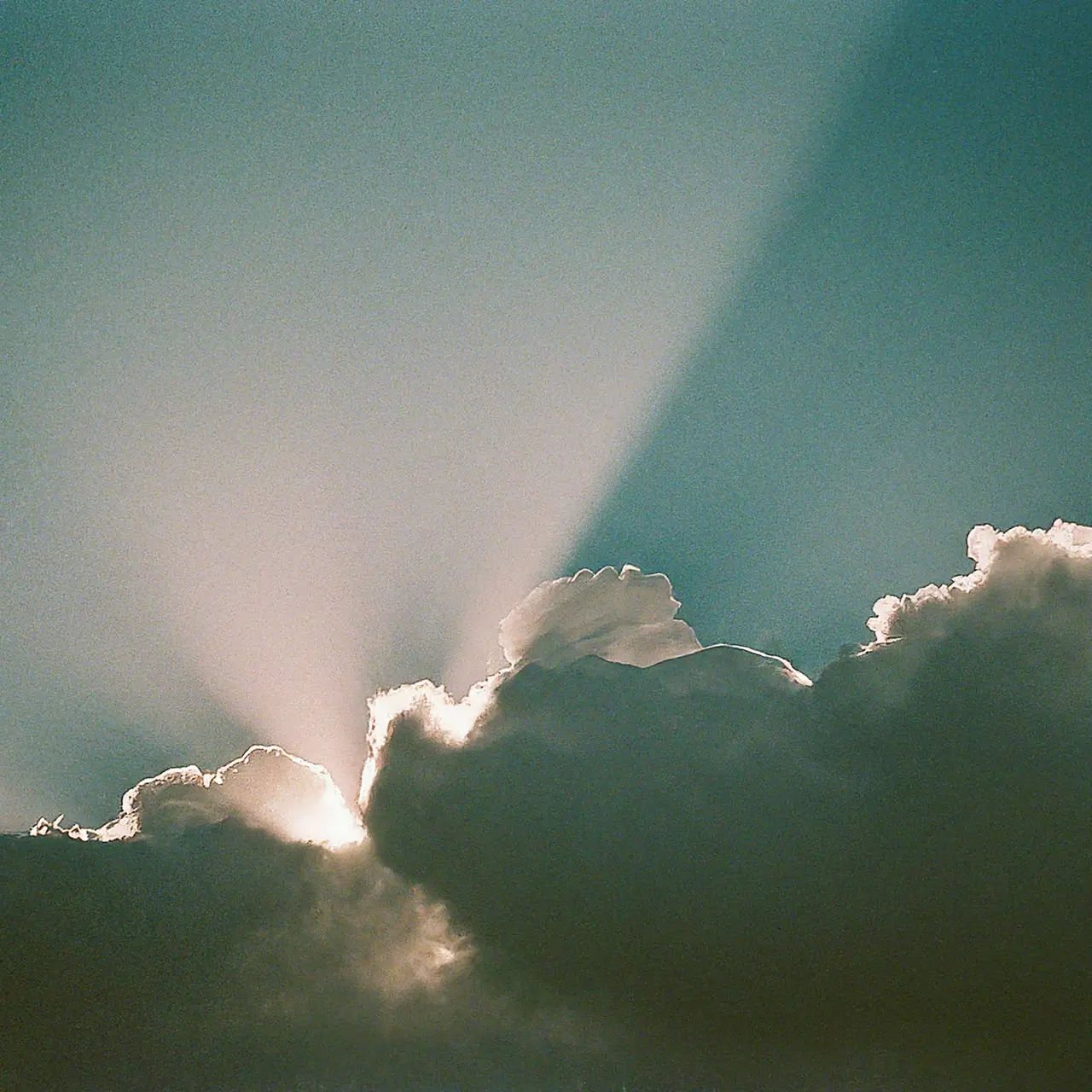 Clouds shining over a network of connected digital devices. 35mm stock photo