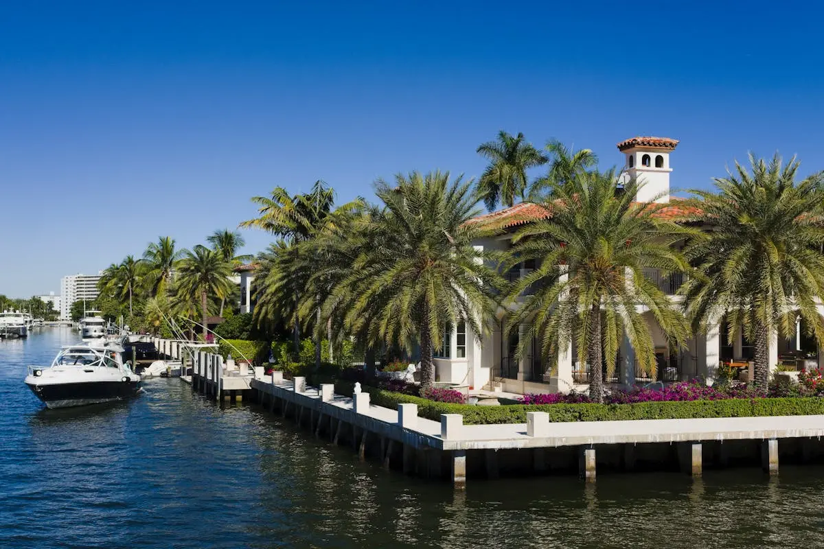 View of Boats on a River near the Palm Trees and Mansions in Fort Lauderdale, Florida, USA
