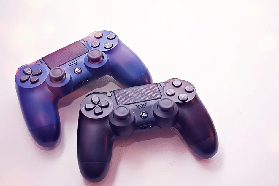 Close-up of two PlayStation controllers on a white surface, perfect for gaming themes.