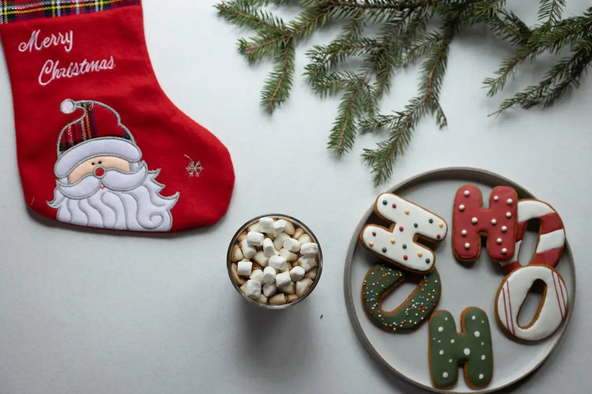 Christmas flat lay with stocking, cookies, and hot cocoa. Perfect for festive occasions.