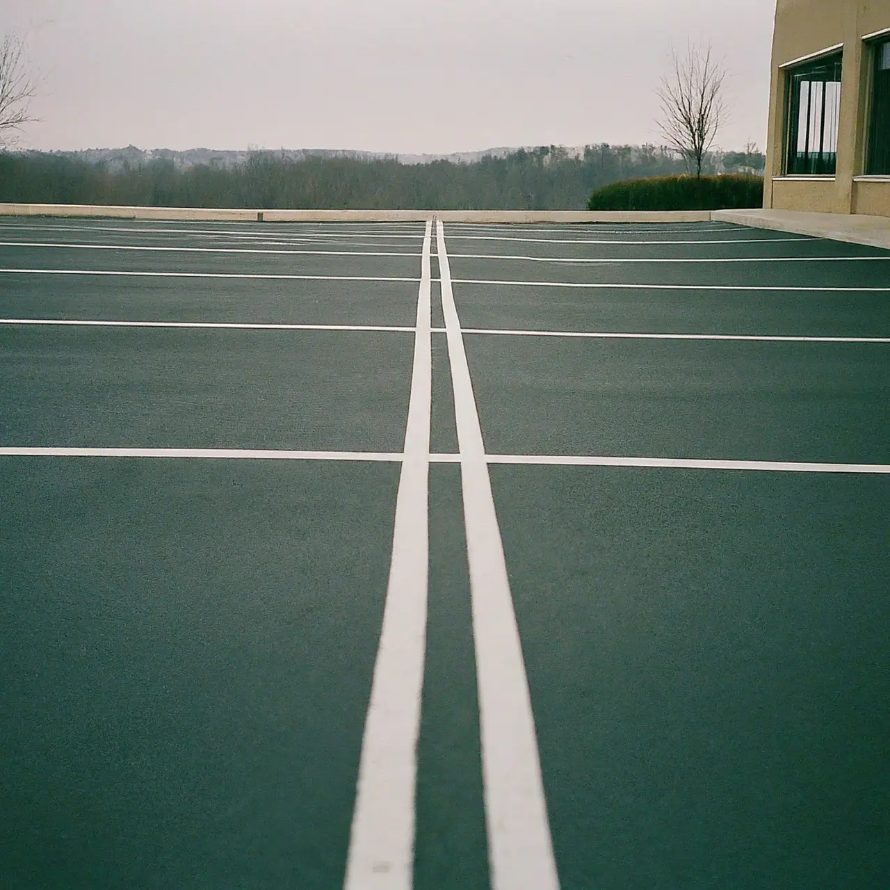 Empty, well-maintained commercial parking lot with clear lines. 35mm stock photo