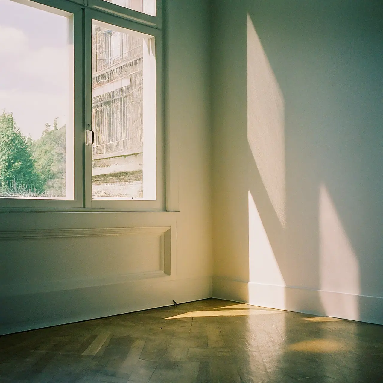 Sparkling clean empty room with sunlight streaming through windows. 35mm stock photo