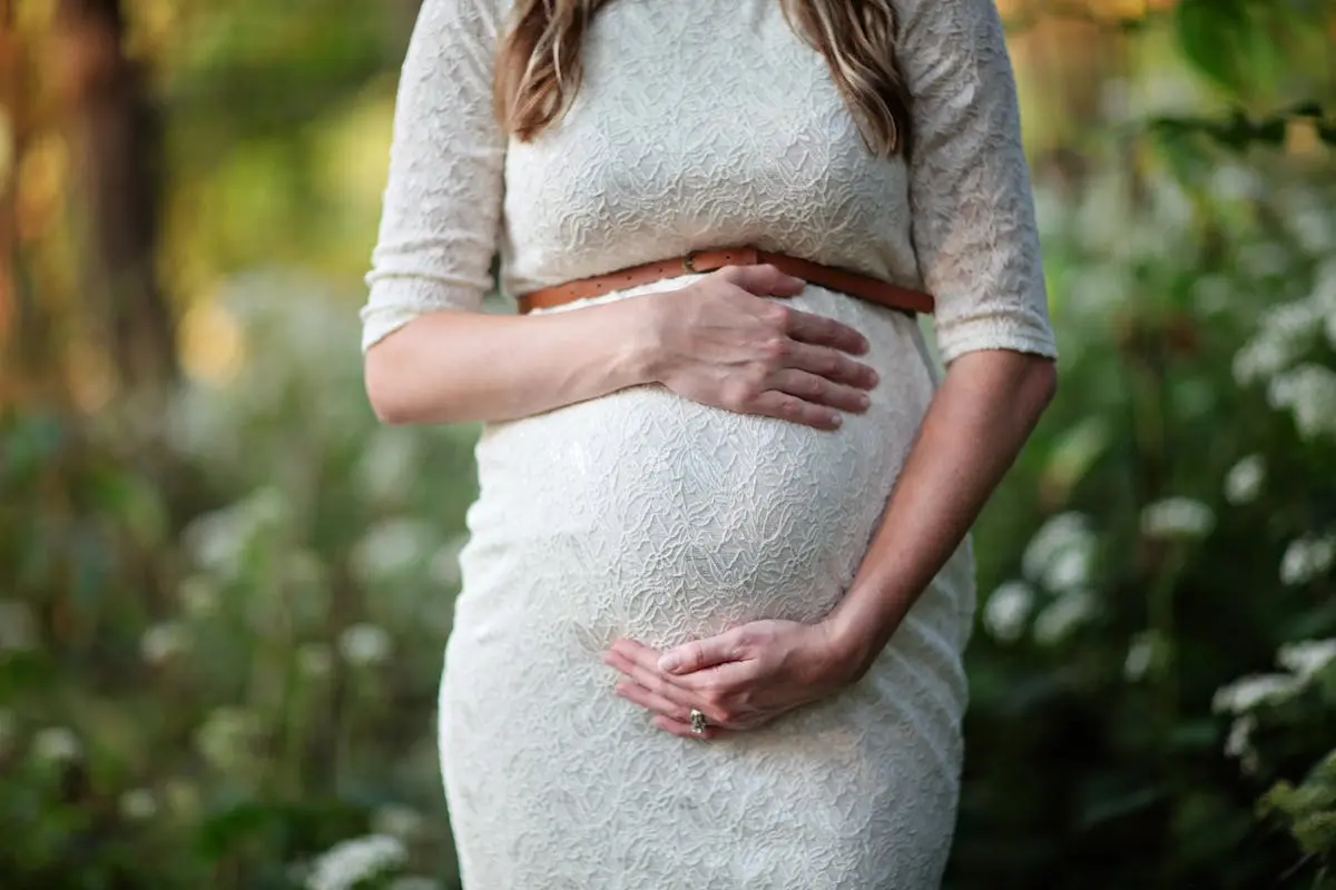 A pregnant woman cradling her belly, representing the topic of Botox during pregnancy and the safety considerations for botulinum toxin injections. It symbolizes the importance of consulting healthcare providers about risks and alternatives for cosmetic treatments like Botox while pregnant.