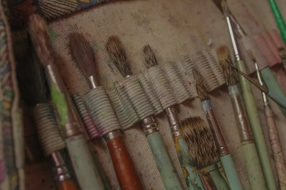 A close up of a bunch of brushes and paint