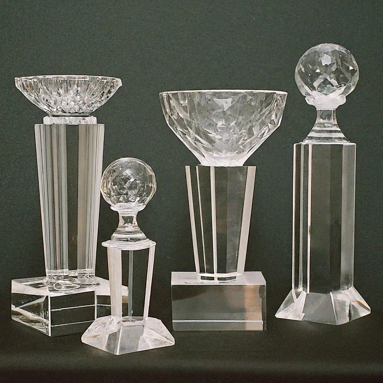 Crystal trophies of various sizes on a podium. 35mm stock photo