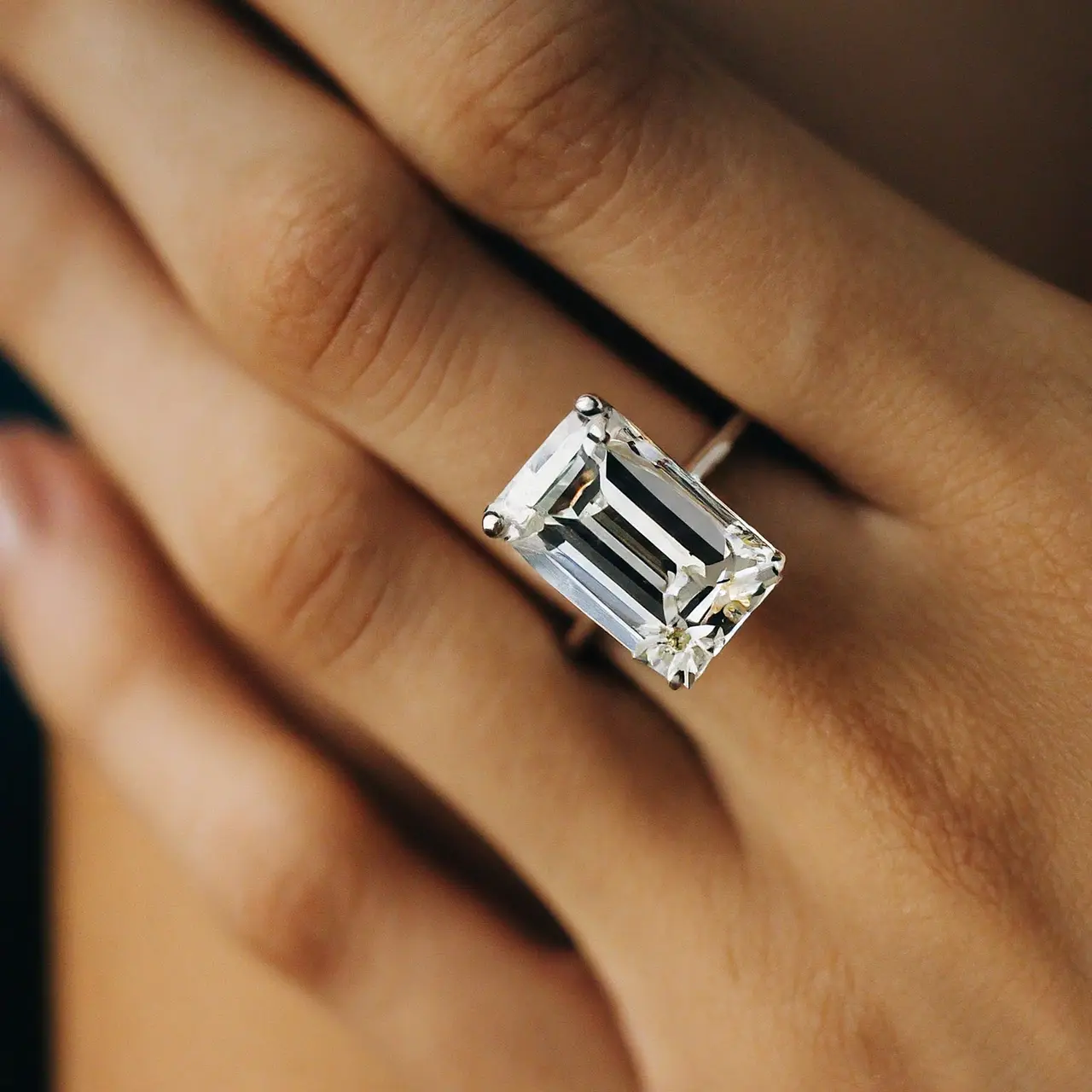 A close-up of a sparkling emerald cut diamond ring. 35mm stock photo