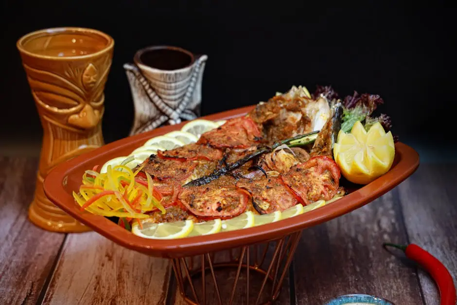 A platter with food on it and a glass of wine