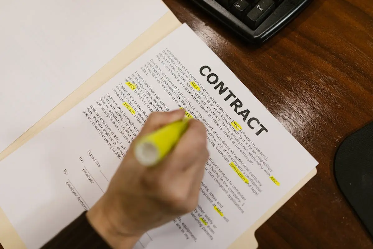 Close-Up Shot of a Person Holding a Contract
