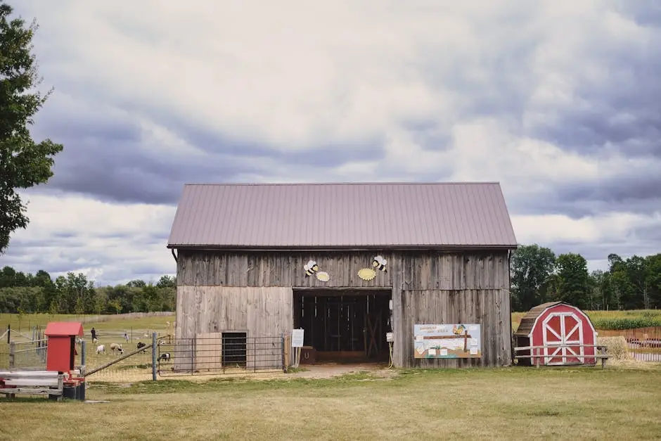 Scenic view of a rustic barn surrounded by countryside, ideal for agricultural themes.