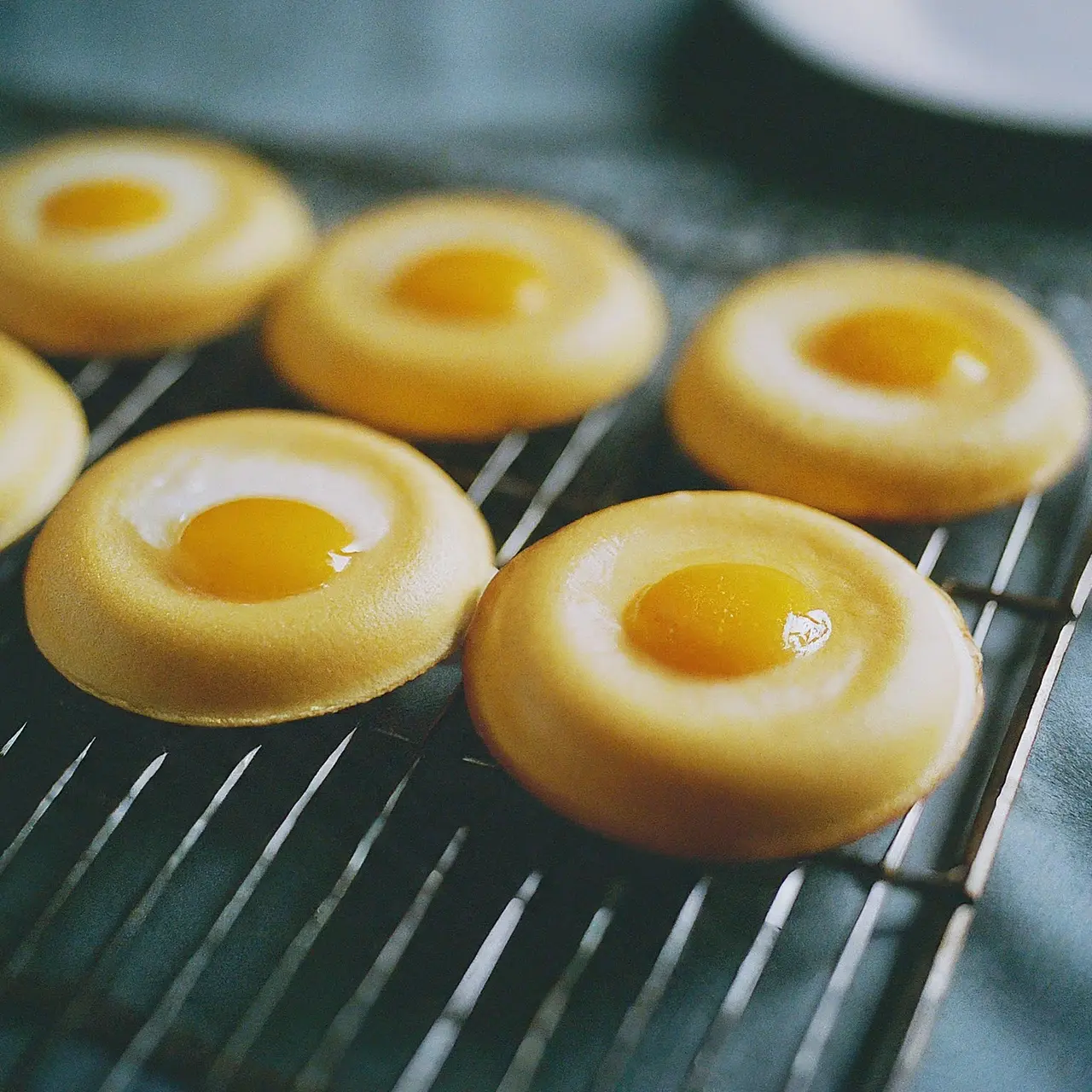 Freshly made Hong Kong Egglets on a cooling rack. 35mm stock photo