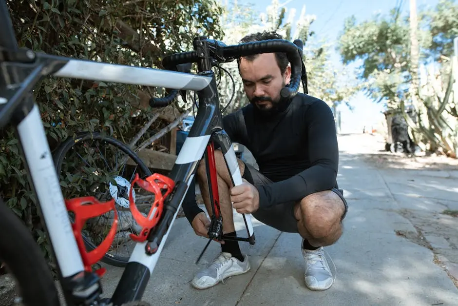 Man in Black Long Sleeve Shirt Repairing His Bike