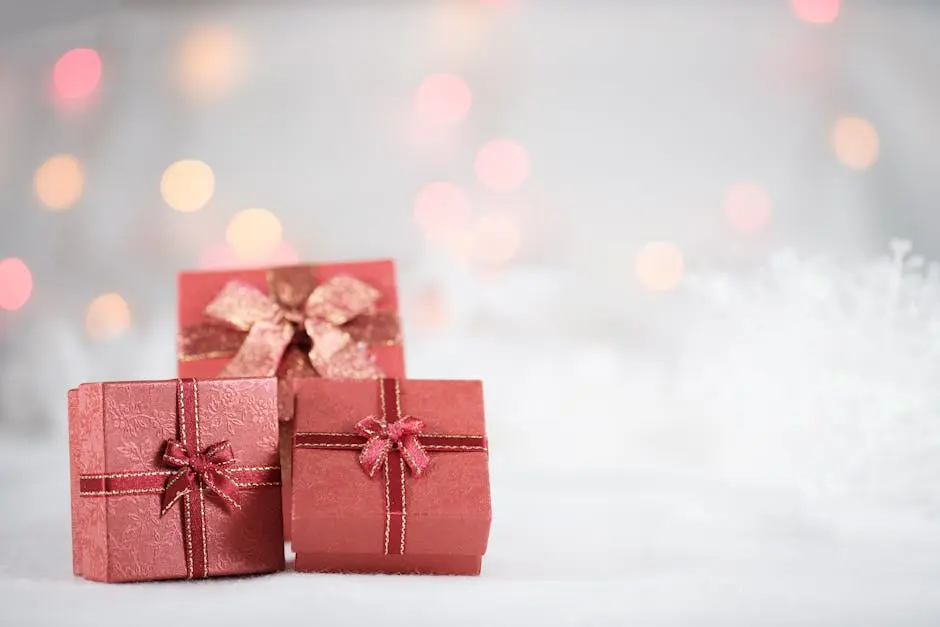 Elegant red gift boxes with ribbons and bows, set against a festive bokeh backdrop.