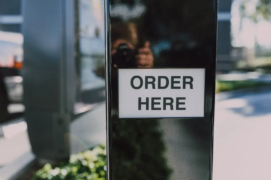 Close-up of an order sign at a drive-thru station, ideal for business contexts.