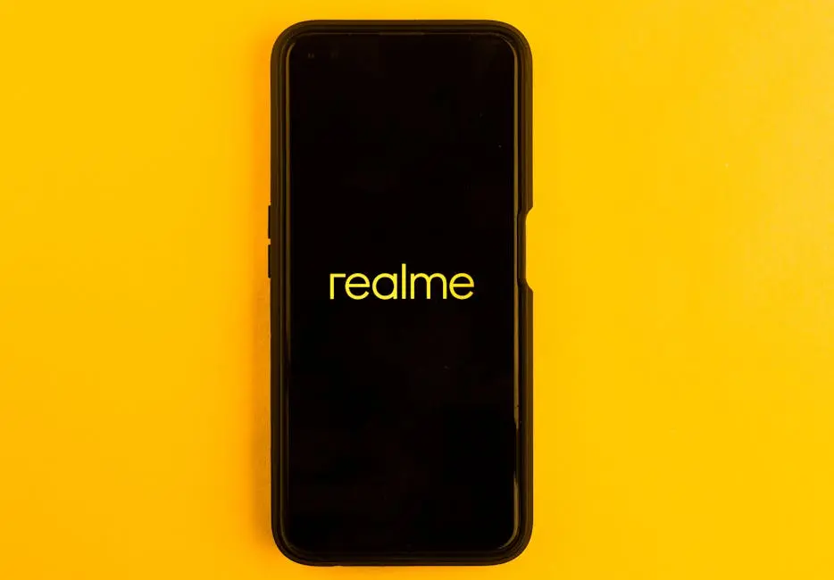 Realme smartphone displayed against a bright yellow backdrop, emphasizing modern technology.