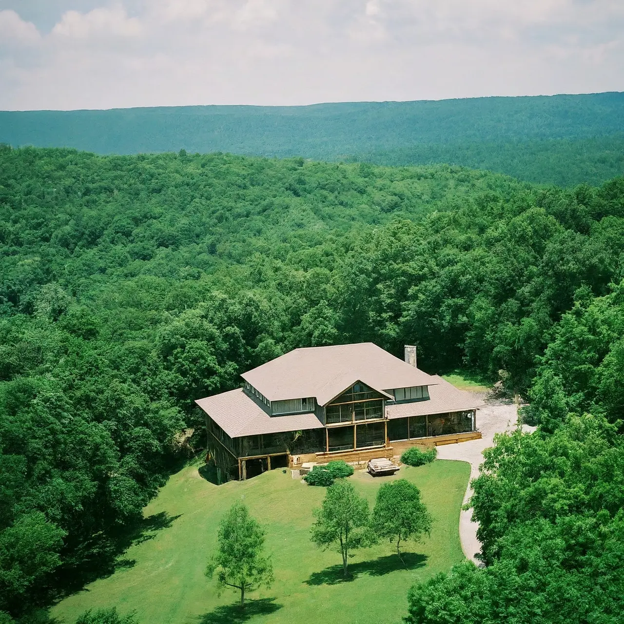 A luxurious vacation rental home nestled in lush Arkansas landscape. 35mm stock photo