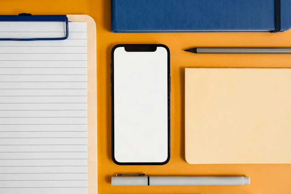 A Flatlay of a Smartphone and Office Supplies