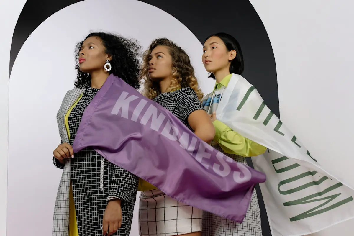 Women Holding Textiles with Slogan