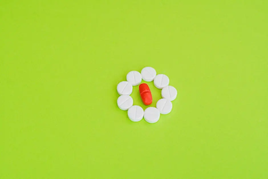 White tablets encircle a red pill on a bright green background, symbolizing choice.