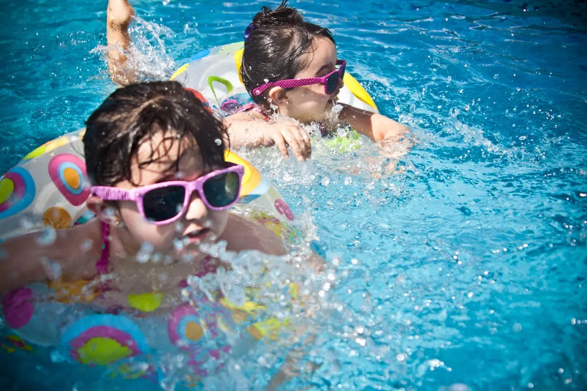 2 Girl’s Swimming during Daytime