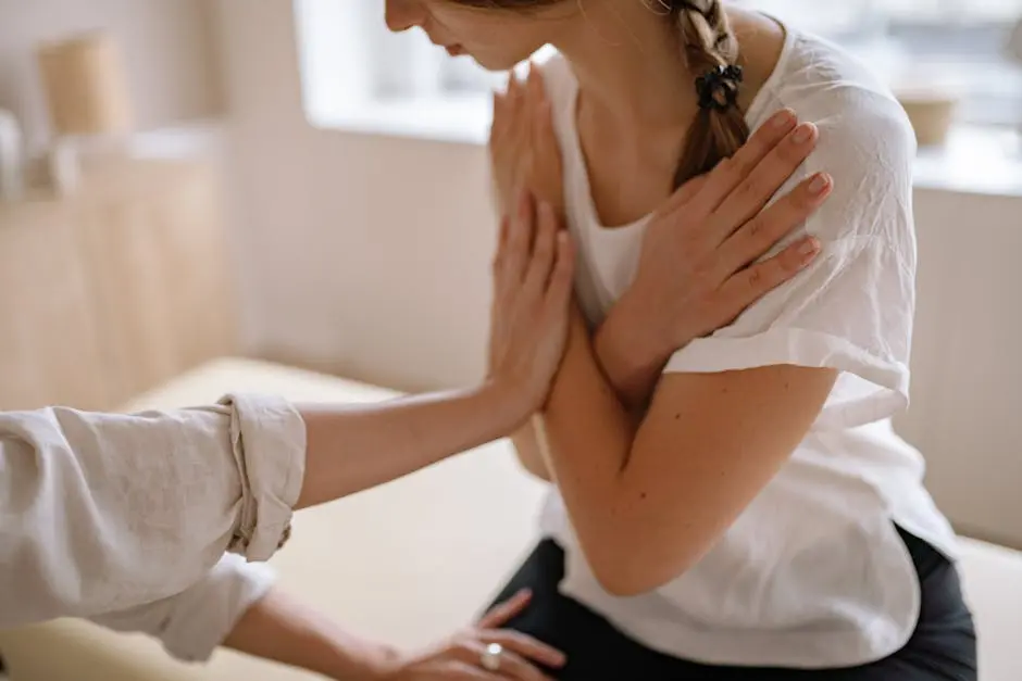 Woman receiving chiropractic therapy with a specialist in an indoor setting.