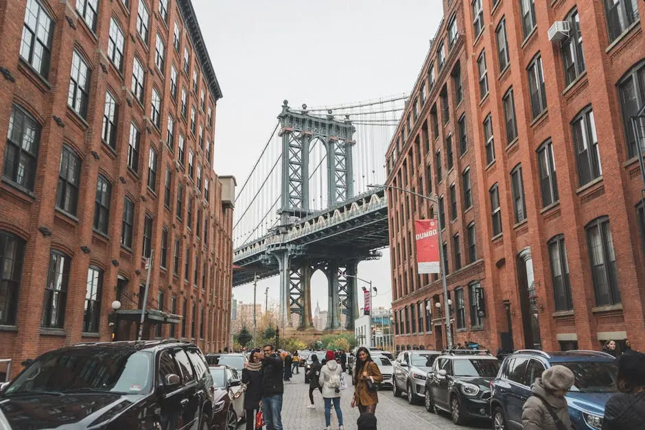 Scenic view of the Manhattan Bridge framed by urban architecture in DUMBO, Brooklyn, NYC.